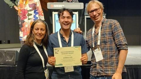 Joshua Lee (centre) with his Ecological Society of Australia award and   (left) Rachael Gallagher, Associate Professor at Hawkesbury Institute for the Environment   and (right) NSW Biodiversity Conservation Trust Principal Ecologist, James Bazill-Boast.